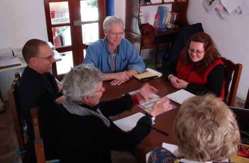 Richard, Miguel, Maestra Edith, Milly and Jilita playing a game of Spanish grammar Jeopardy.